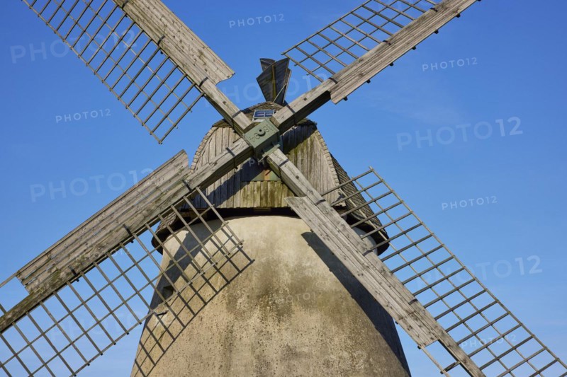 Wings of the windmill Auf der Hoechte under a cloudless blue sky in Hille, Muehlenkreis Minden-Luebbecke, North Rhine-Westphalia, Germany, Europe