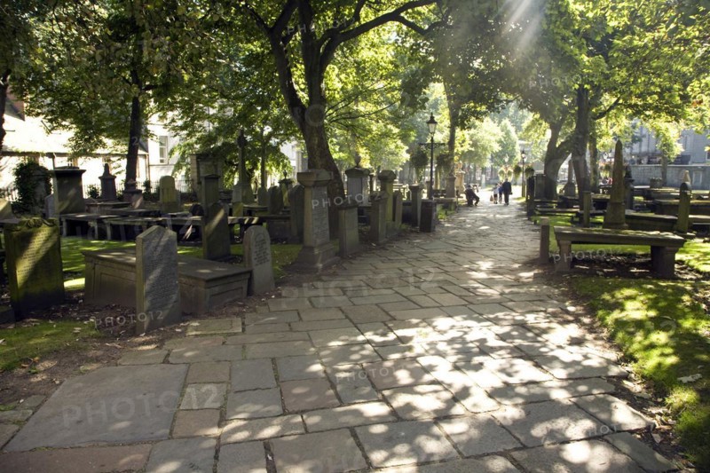 Lens flare, Graves in churchyard, Saint Nicholas Kirk, Aberdeen, Scotland, United Kingdom, Europe