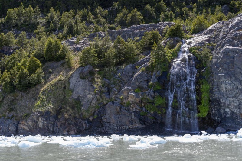 Waterfall, floating ice, Lago Grey, Torres del Paine National Park, Parque Nacional Torres del Paine, Cordillera del Paine, Towers of the Blue Sky, Region de Magallanes y de la Antartica Chilena, Ultima Esperanza Province, UNESCO Biosphere Reserve, Patagonia, End of the World, Chile, South America