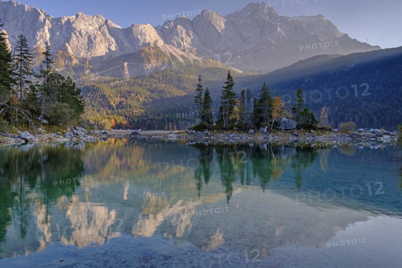 Mountain lake in front of steep mountains, reflection, evening light, autumn, Eibsee lake, view of Zugspitze, Bavaria, Germany, Europe