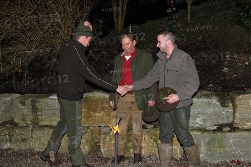 Wild boar (Sus scrofa) Hunting guide presents hunter with a gun after the hunt, tradition, Allgaeu, Bavaria, Germany, Europe
