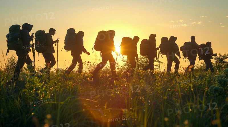 Silhouettes of hikers trekking during sunset in the outdoors, AI generated