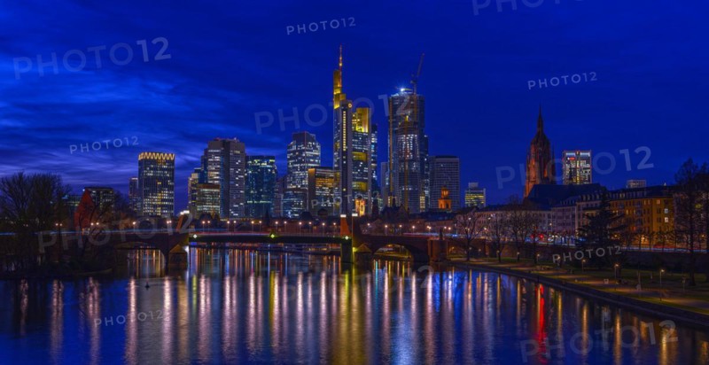 The Frankfurt skyline with office tower blocks behind the Main at blue hour after sunset, on the right the Kaiserdom, Frankfurt am Main, Hesse, Germany, Europe