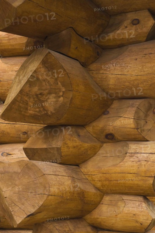 Stacked Eastern White pine logs forming the exterior corner walls on a luxurious Scandinavian style log home, Quebec, Canada, North America