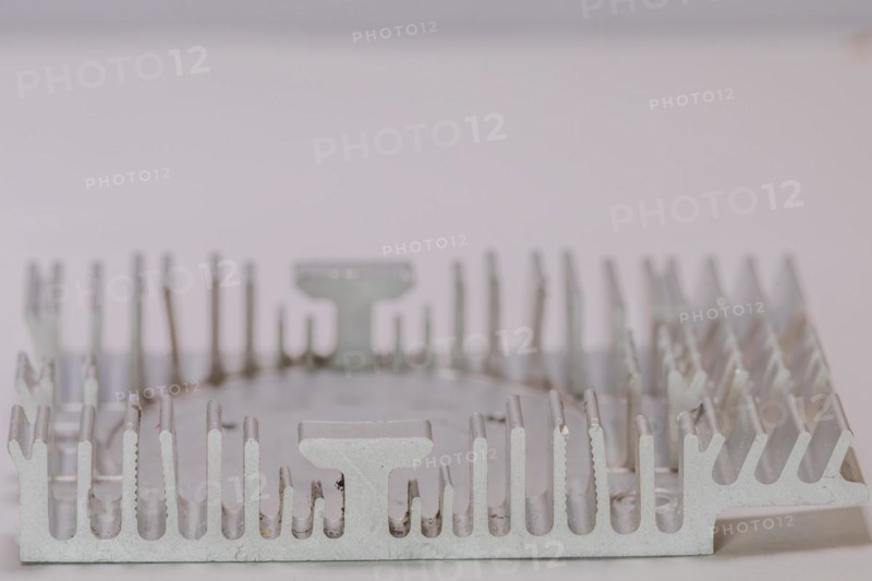 Closeup of fins of rectangle aluminum heat sink on white background