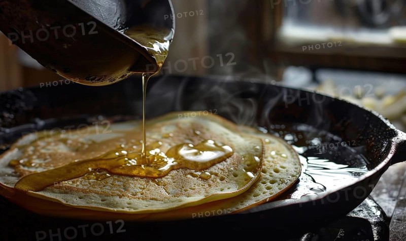 Pouring syrup on freshly cooked pancakes in a steaming cast iron pan AI generated