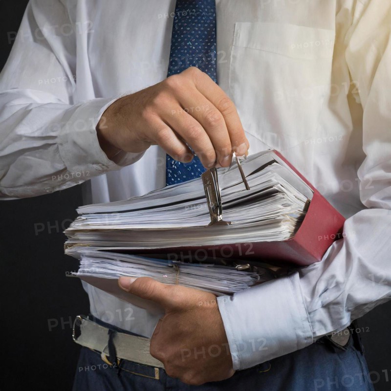 A man in formal attire holds an overstuffed briefcase, symbolism bureaucracy, AI generated, AI generated