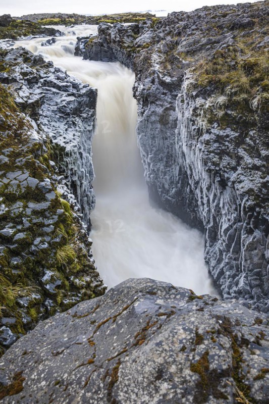 Rushing stream plunges into a narrow gorge, Fjallabak Nature Reserve, Sudurland, Iceland, Europe