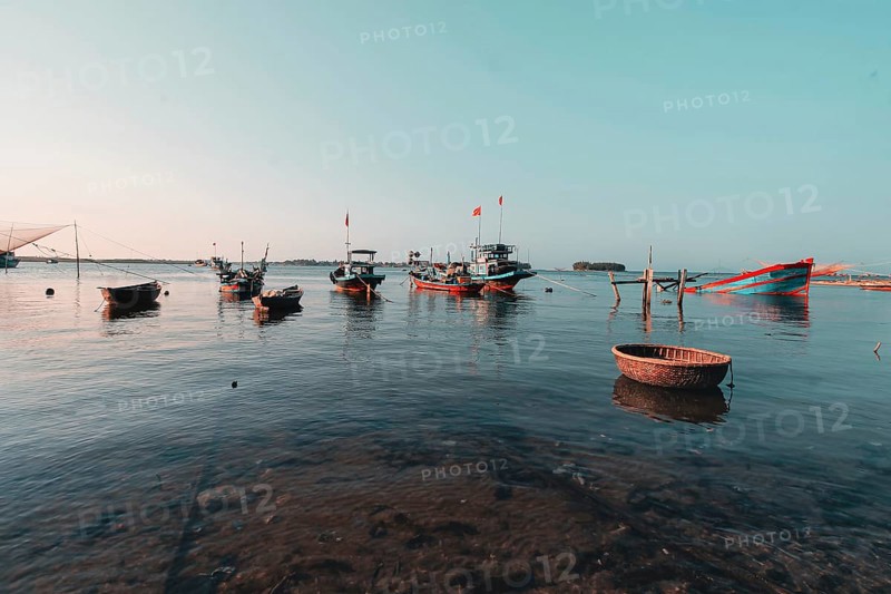 Scenic view of traditional Vietnamese fishing boats in Phan Thiet fishing village in Mui Ne, Vietnam, Asia