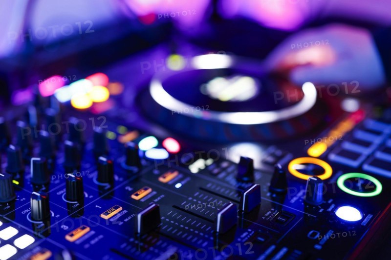 Hand of a DJ on a mixing desk, also called DJ controller or DJ console, at a party, Cologne, North Rhine-Westphalia, Germany, Europe