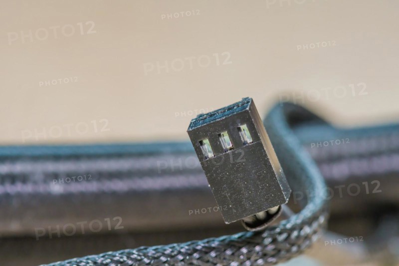 Close-up of a USB plug with metallic and black color scheme, in South Korea