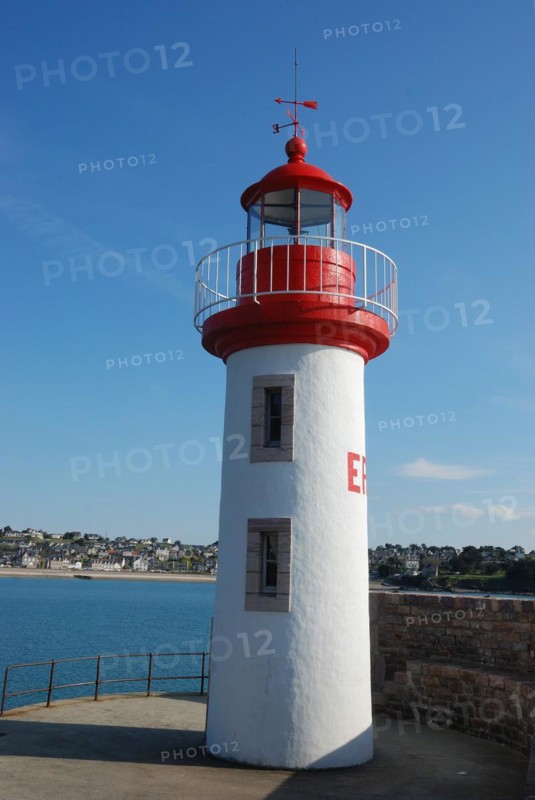 Lighthouse on a blue sky in Erquy