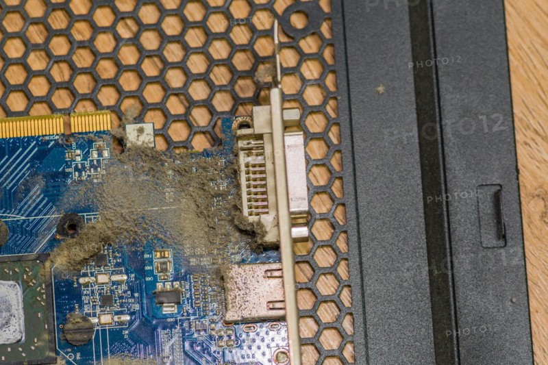 A dusty electronic PC card and connector with visible debris, in South Korea