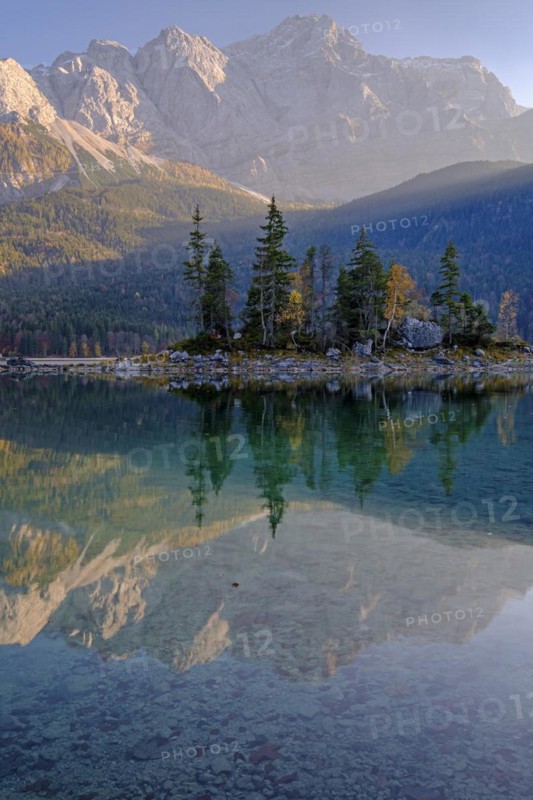 Mountain lake in front of steep mountains, reflection, evening light, autumn, Eibsee lake, view of Zugspitze, Bavaria, Germany, Europe