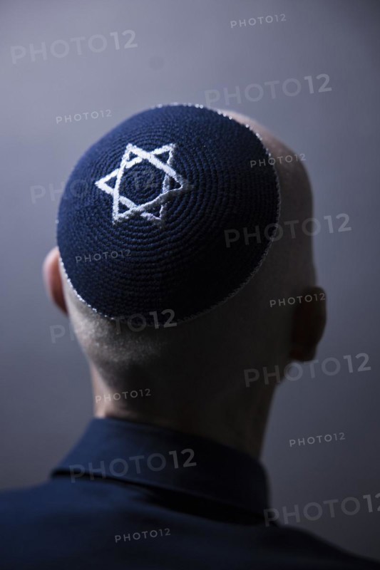 Jewish man wearing a kippa with a Star of David on his head, back view, studio shot, Germany, Europe