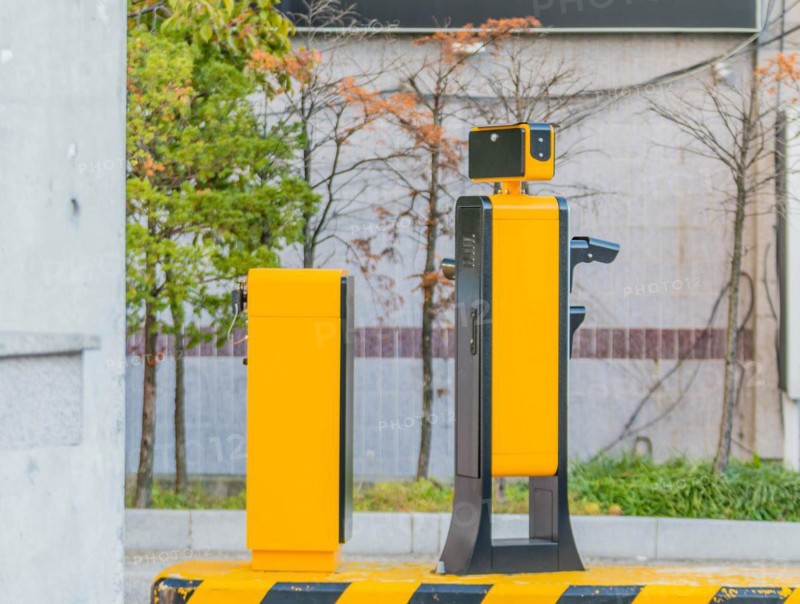 Side view of device to read license plates and calculate charges as cars enter and exit parking garage in Daejeon, South Korea, Asia