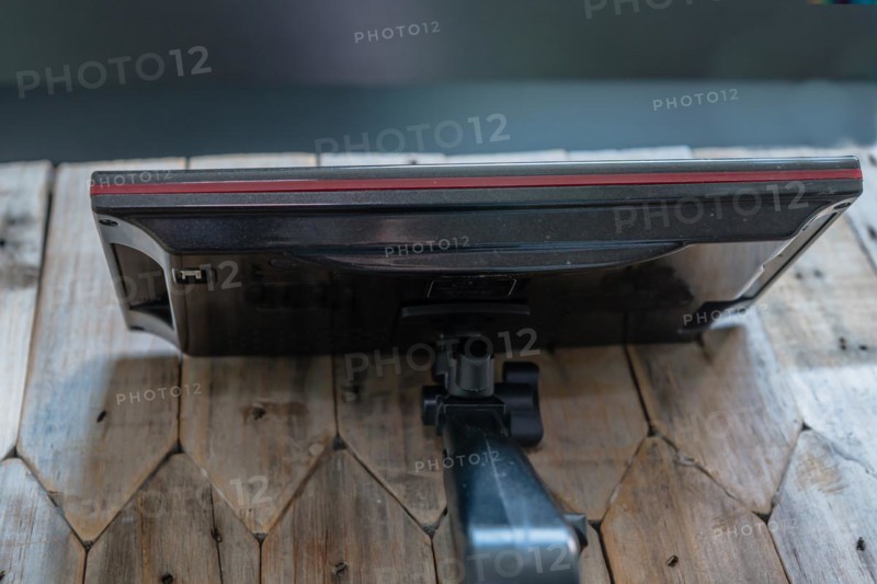 Top and back view of automobile navigation with attached mounting arm