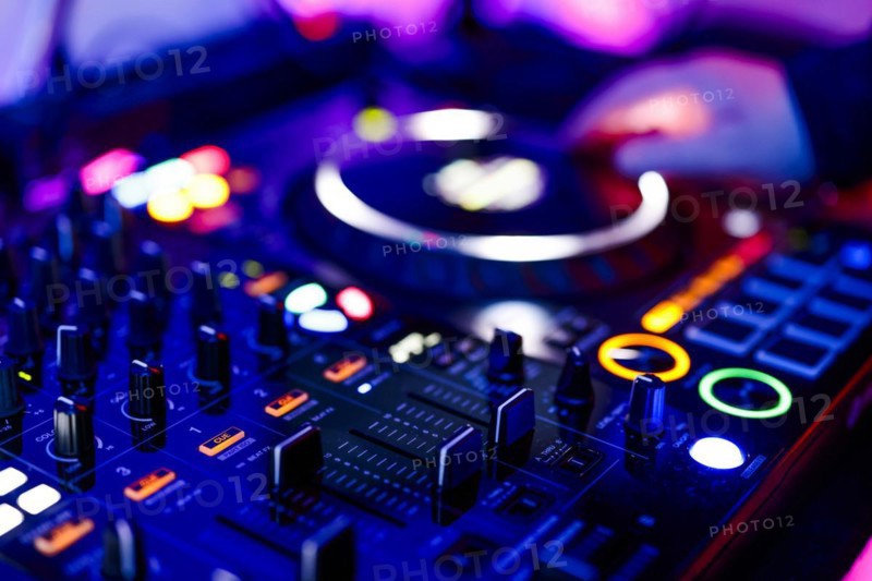 Hand of a DJ on a mixing desk, also called DJ controller or DJ console, at a party, Cologne, North Rhine-Westphalia, Germany, Europe