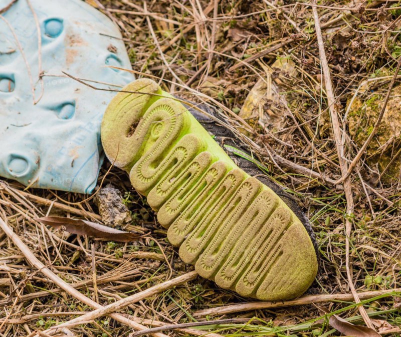 Discarded dirty shoe left in the outdoor environment, in South Korea