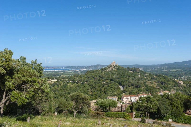 Landscape with the castle of Grimaud, in the background the Gulf of Sant-Tropez and the hills of the Massif des Maures, Grimaud-Village, Var, Provence-Alpes-Cote d'Azur, France, Europe