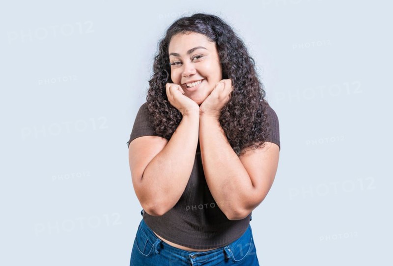 Happy girl face looking and smiling at the camera isolated. Portrait of beautiful girl smiling at the camera isolated