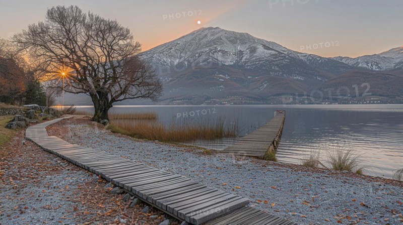 A serene winter sunset by a lake with a jetty and mountains in the background, image depicting relaxation, recreation, serenity, naturalness, meditation, enjoyment concepts, AI generated