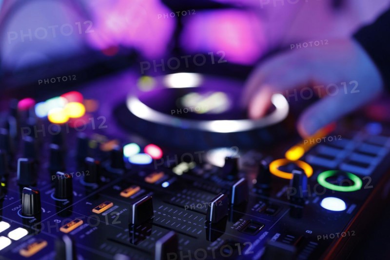 Hand of a DJ on a mixing desk, also called DJ controller or DJ console, at a party, Cologne, North Rhine-Westphalia, Germany, Europe