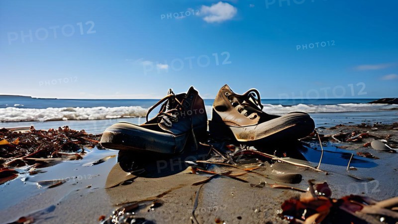Pair of empty shoes on the shore of a beach marred by plastic waste symbolizing human influence, AI generated