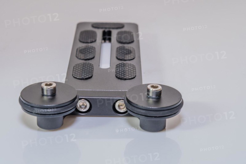 Closeup of end plate of lens support on tripod head for use with large zoom lens