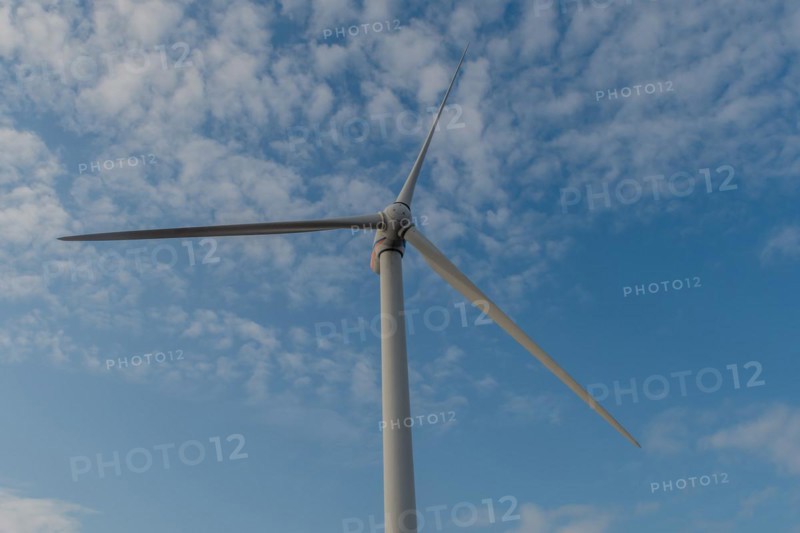 Low angle view of electrical generating windmill against cloudy sky in Buan, South Korea, Asia