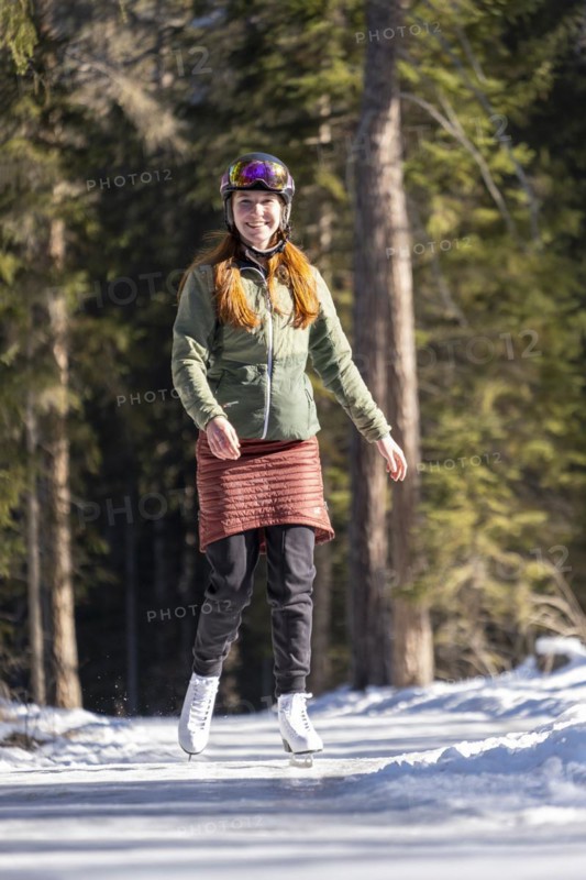 Ice skater, ice path through the forest, Sur En, Sent near Scuol, Engadin, Switzerland, Europe