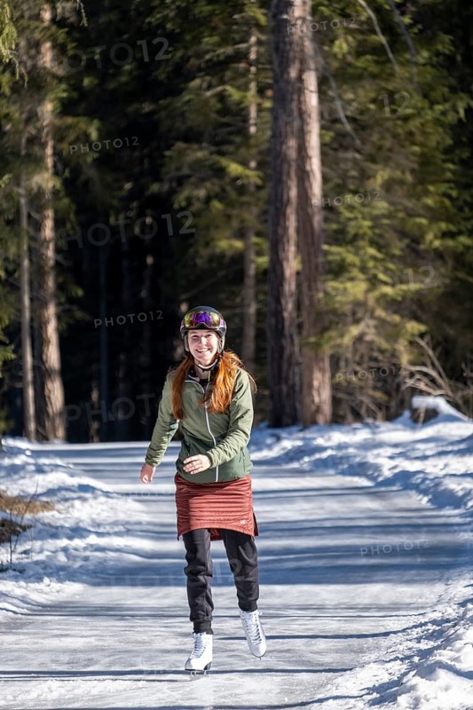 Ice skater, ice path through the forest, Sur En, Sent near Scuol, Engadin, Switzerland, Europe