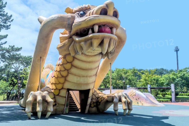 Playground equipment in the shape of a large dragon under a blue sky, in Ulsan, South Korea, Asia