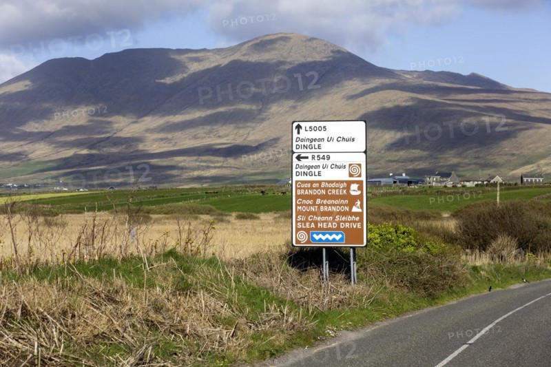 An Irish language road sign in the heart of the Kerry Gaeltacht or Irish-speaking area showing the way to Dingle and Mount Brandon