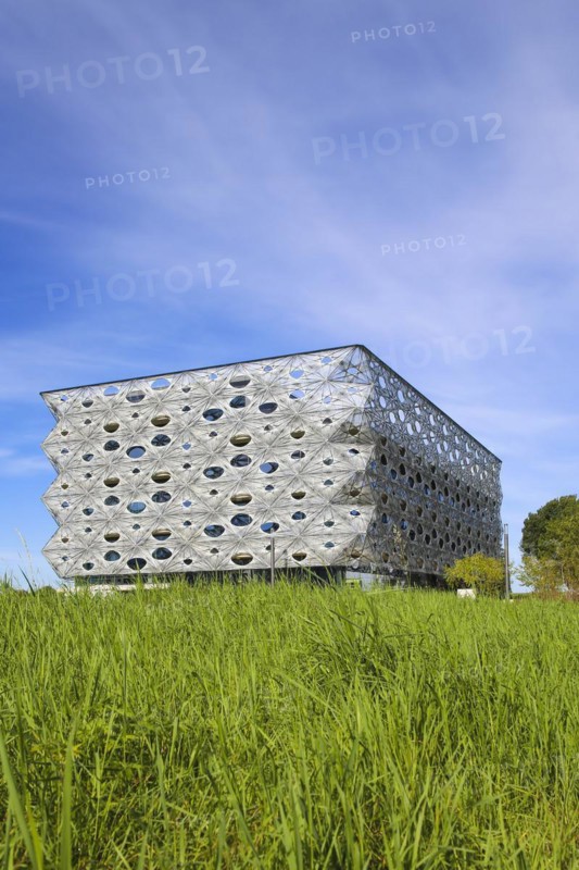 Reutlingen University, Reutlingen University, Texoversum, German University Building Award 2024 for TEXOVERSUM, modern architecture, facade made of carbon and glass fibres, mesh, innovative, identity-creating, unique facade, campus, place of learning, special, extraordinary new building for textile courses, light, airy, airy, holes, architectural eye-catcher, green meadow, university campus, Reutlingen, Baden-Wuerttemberg, Germany, Europe