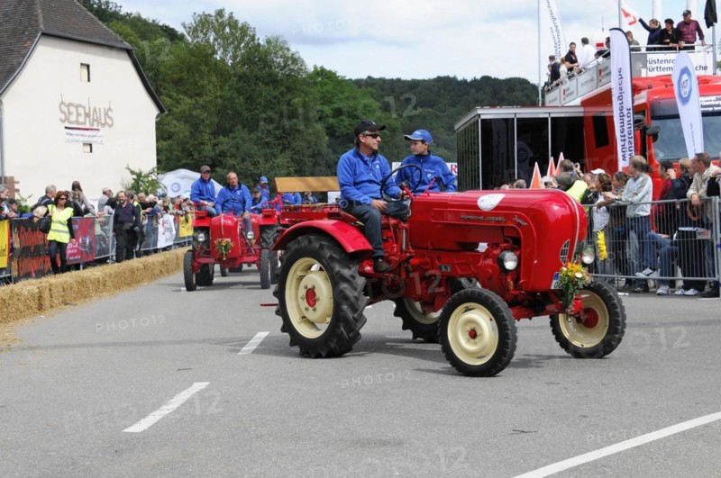 Porsche diesel tractors, drivers in blue present their red vintage tractors at a street festival, SOLITUDE REVIVAL 2011, Stuttgart, Baden-Wuerttemberg, Germany, Europe