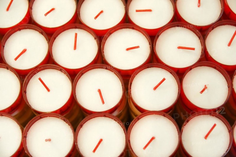 Church of Notre-Dame de la Garde, Marseille, Several white candles in red containers form an orderly group, Marseille, Departement Bouches du Rhone, Region Provence Alpes Cote d'Azur, France, Europe