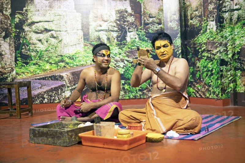 Kathakali performers or mime artists, 38 and 60 years old, make up their faces, Kochi Kathakali Centre, Kochi, Kerala, India, Asia