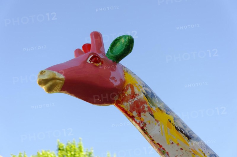 Head of a colourful giraffe statue in front of a clear blue sky, Marseille, Departement Bouches-du-Rhone, Provence-Alpes-Cote d'Azur region, France, Europe