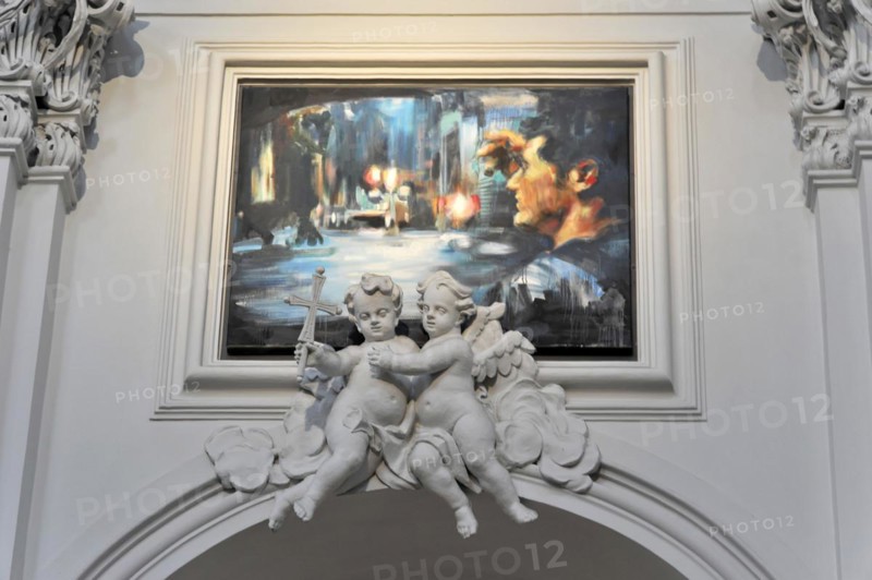 The Neumuenster Collegiate Abbey, Diocese of Wuerzburg, Two statues of angels with an abstract painting in the background in a baroque setting, Wuerzburg, Lower Franconia, Bavaria, Germany, Europe