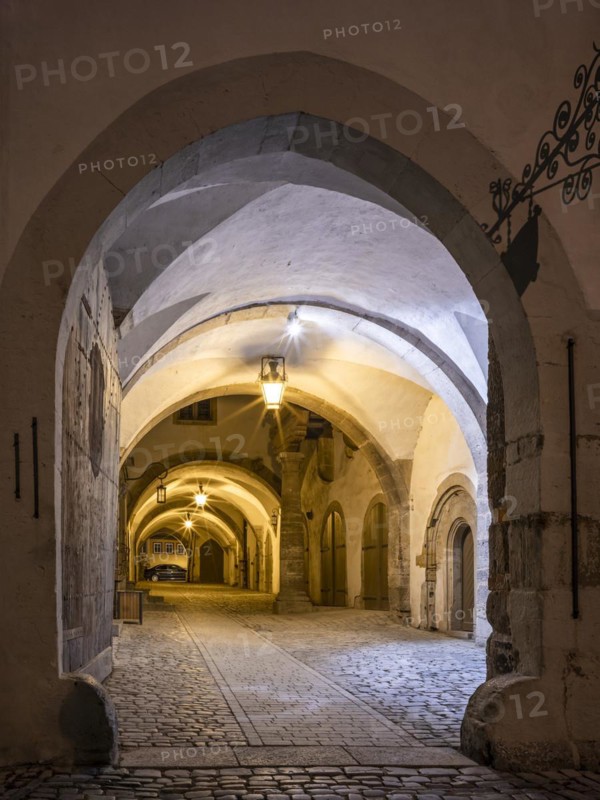 Inner courtyard in the Gothic part of the town hall at night, portal and passageway with lanterns, Rothenburg ob der Tauber, Middle Franconia, Bavaria, Germany, Europe