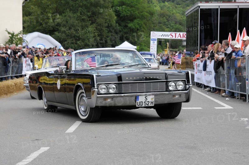 Black American convertible classic car with US flag in front of spectators, SOLITUDE REVIVAL 2011, Stuttgart, Baden-Wuerttemberg, Germany, Europe