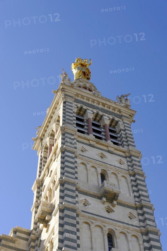 Church of Notre-Dame de la Garde, Marseille, Tower of a church with golden sculptures in front of a blue sky, Marseille, Departement Bouches du Rhone, Region Provence Alpes Cote d'Azur, France, Europe