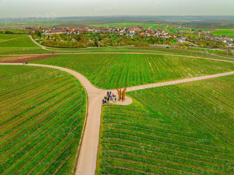 People standing at a fork in a vineyard with a village in the distance, Jesus Grace Chruch, Weitblickweg, Easter hike, Hohenhaslach, Germany, Europe