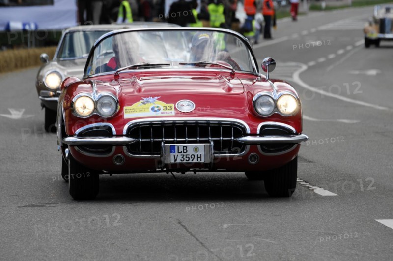 A red Corvette Cabriolet at a street race, surrounded by spectators, SOLITUDE REVIVAL 2011, Stuttgart, Baden-Wuerttemberg, Germany, Europe