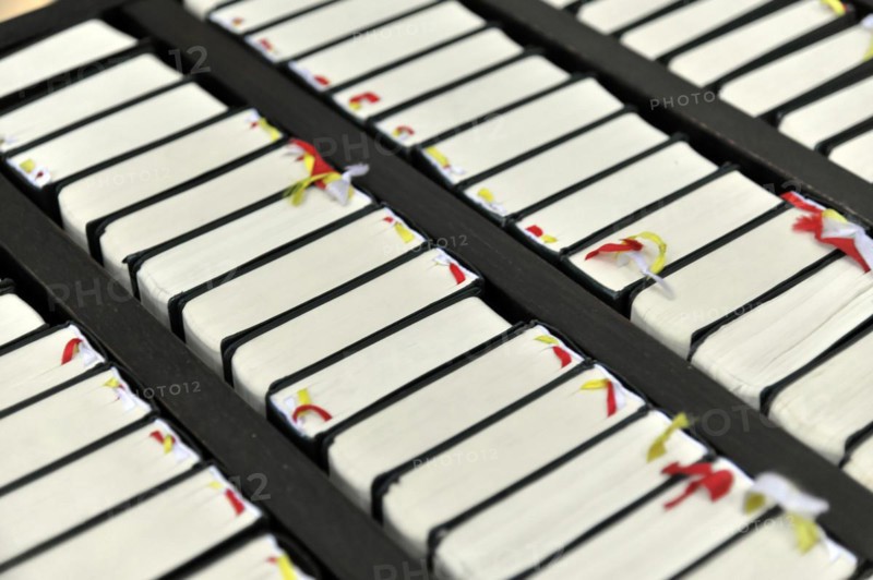The Neumuenster Collegiate Abbey, Diocese of Wuerzburg, Kardinal-Doepfner-Platz, close-up of hymnals, Wuerzburg, Lower Franconia, Bavaria, Germany, Europe