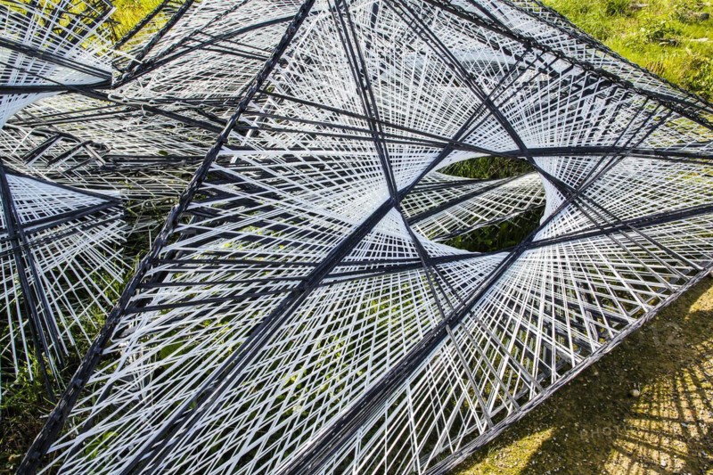 Facade material for the Texoversum, construction site, facade mesh lies on the ground, Reutlingen University, Reutlingen University, German University Building Award 2024 for TEXOVERSUM, modern architecture, elements, mesh made of carbon and glass fibres, innovative, identity-creating, unique facade, campus, place of learning, special, extraordinary new building for textile courses, light, airy, airy, holes, architectural eye-catcher, Reutlingen, Baden-Wuerttemberg, Germany, Europe
