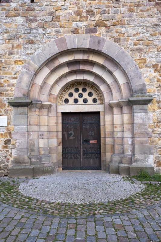 Slogan All and in all Christ above a door of St Mary's Cathedral, Havelberg, Saxony-Anhalt, Germany, Europe