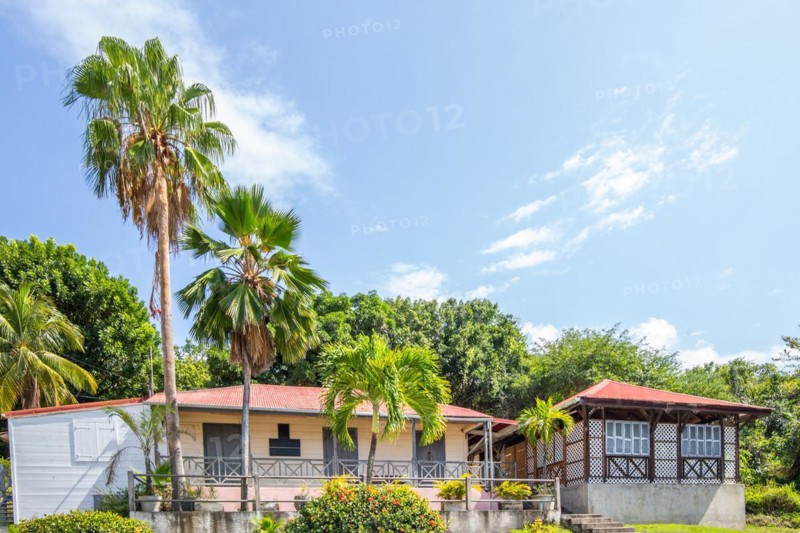 Deshaies, historic Caribbean wooden building of a street in Guadeloupe, Caribbean, French Antilles