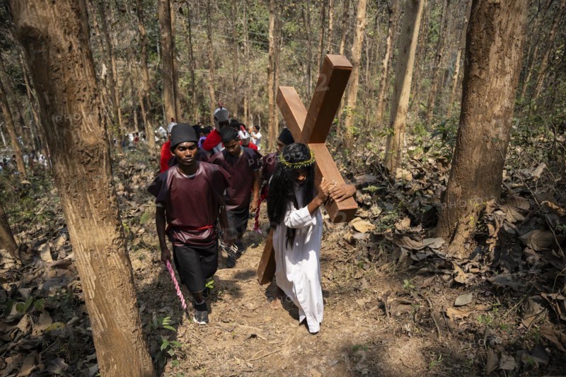 Christian devotees takes part in a perform to re-enactment of the crucifixion of Jesus Christ during a procession on Good Friday, on March 29, 2024 in Guwahati, Assam, India. Good Friday is a Christian holiday commemorating the crucifixion of Jesus Christ and his death at Calvary